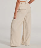 The Essential High-Rise Corduroy Wide-Leg Cargo Pants is a trendy women's bottom in ivory, designed with modern details and alluring textures to complete chic outfits for 2025.