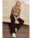 The The Next Level High-Rise Cargo Pants is a trendy women's bottom in black, designed with modern details and alluring textures to complete chic outfits for 2025.