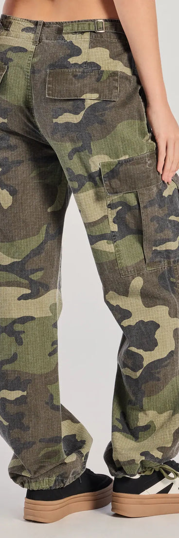 The Cool Girl Energy Camo Cargo Pants is a trendy women's bottom in olive green, designed with modern details and alluring textures to complete chic outfits for 2025.