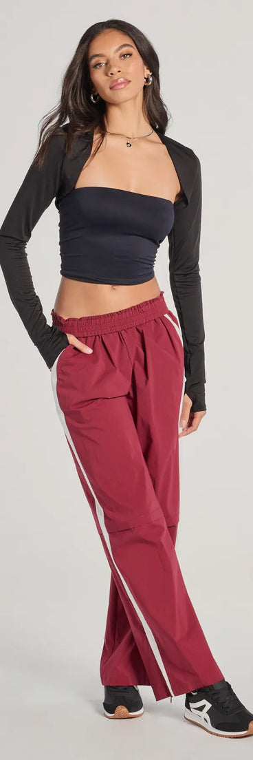 The Star Of The Track High-Rise Striped Track Pants is a trendy women's bottom in burgundy, designed with modern details and alluring textures to complete chic outfits for 2025.
