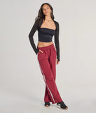 The Star Of The Track High-Rise Striped Track Pants is a trendy women's bottom in burgundy, designed with modern details and alluring textures to complete chic outfits for 2025.