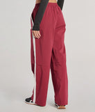 The Star Of The Track High-Rise Striped Track Pants is a trendy women's bottom in burgundy, designed with modern details and alluring textures to complete chic outfits for 2025.