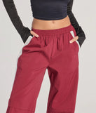 Create bold, fashion-forward looks for spring or summer with the Star Of The Track High-Rise Striped Track Pants in burgundy, a must-have piece from Windsor’s collection of stylish bottoms for women.