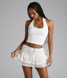 The Lookin' Cutesy Floral Ruffled Mini Skort in off-white features a short, flattering cut designed to elevate your look with just the right amount of edge.
