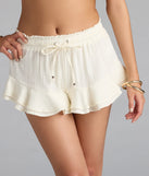 Complete your summer wardrobe with the Effortless Chic Mid-Rise Ruffled Shorts, trendy shorts in off-white made to mix, match, and stand out.