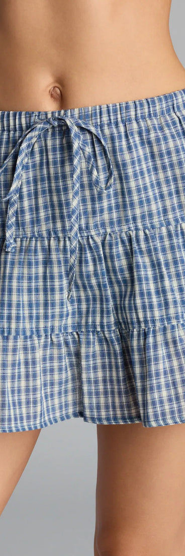 Make a fall statement in blue tones that highlight the Prep It Up Ruffled Plaid Mid-Rise Skort as a must-have among fall bottoms for women.