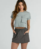 Get the look of a skirt and the comfort of shorts in the Taking Flight Cargo Mini Skort in charcoal, perfect for staying stylish while on the move this summer.