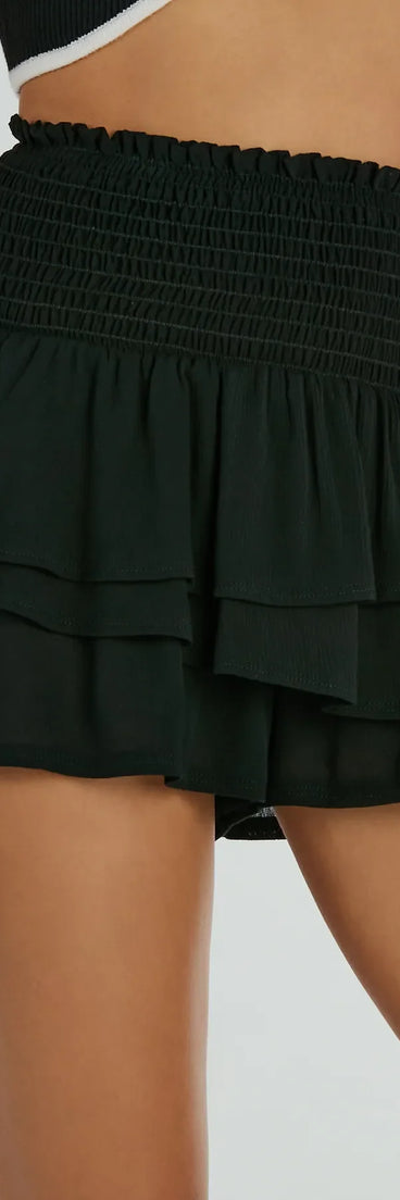 The Cheers To Sunshine Smock High Waist Ruffled Shorts is a trendy women's bottom in black, designed with modern details and alluring textures to complete chic outfits for 2025.