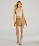 The City Sensation High-Rise Buckle Pleated Skort is a trendy women's bottom in khaki, designed with modern details and alluring textures to complete chic outfits for 2025.
