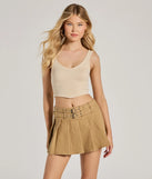 The City Sensation High-Rise Buckle Pleated Skort is a trendy women's bottom in khaki, designed with modern details and alluring textures to complete chic outfits for 2025.