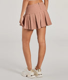 The Practical Charm High Rise Zipper Pleated Denim Skort is a trendy women's bottom in mauve, designed with modern details and alluring textures to complete chic outfits for 2025.