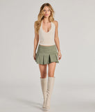 Get the look of a skirt and the comfort of shorts in the Stylish Fave Mid-Rise Pleated Skater Skort in olive green, perfect for staying stylish while on the move this summer.