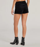 The Playful Season High Rise Corduroy Hot Shorts is a trendy women's bottom in black, designed with modern details and alluring textures to complete chic outfits for 2025.