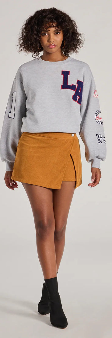 Upgrade your style game for 2025 with the Playful Pleats Faux Leather Drop Waist Skort in black, perfect for any fashion-forward wardrobe.