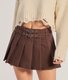 The Looking Cool Belted And Pleated Mini Skort is a trendy women's bottom in brown, designed with modern details and alluring textures to complete chic outfits for 2025.