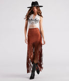 The Wild At Heart Long Fringe Skirt is a trendy women's bottom in tan, designed with modern details and alluring textures to complete chic outfits for 2025.