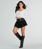 The Play Time Double Belt Woven Mini Skirt in black is a women's workwear piece offering a trendy style and unique accents, perfect for effortlessly creating an outfit-of-the-day look that transitions your office look to going-out ready.