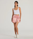 The Sweetest Ever Bow Detail Satin Mini Skirt in pink brings edge and energy to your vibe, ready to elevate any festival look or concert outfit.