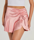 Create bold, fashion-forward looks for summer with the Sweetest Ever Bow Detail Satin Mini Skirt in pink, a must-have piece from Windsor’s collection of stylish bottoms for women.