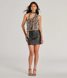 The Bold Aesthetic Coated Faux Leather Mini Skirt is a trendy women's bottom in black, designed with modern details and alluring textures to complete chic outfits for 2025.