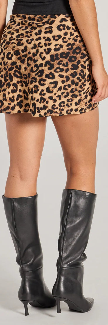 The Flirty Leopard Print Satin Mini Skirt in leopard print features a short, flattering cut designed to elevate your look with just the right amount of edge.