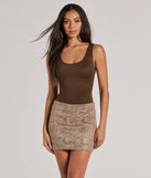 The Chic Mood Snake Print Faux Suede Mini Skirt in taupe features a short, flattering cut designed to elevate your look with just the right amount of edge.