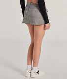 The So Sweet Bow And Plaid Mini Skirt is a trendy women's bottom in black, designed with modern details and alluring textures to complete chic outfits for 2025.
