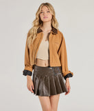 The City Chic Faux Leather Pleated Mini Skirt in brown features a short, flattering cut designed to elevate your look with just the right amount of edge.