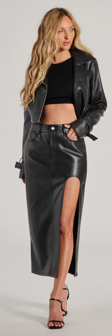 The Sleek Era Faux Leather High Slit Midi Skirt is a trendy women's bottom in black, designed with modern details and alluring textures to complete chic outfits for 2025.