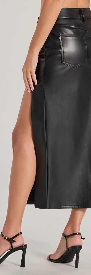 The Sleek Era Faux Leather High Slit Midi Skirt is a trendy women's bottom in black, designed with modern details and alluring textures to complete chic outfits for 2025.
