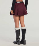 The Downtown Girl Belted Pleated Mini Skirt in plum features a short, flattering cut designed to elevate your look with just the right amount of edge.