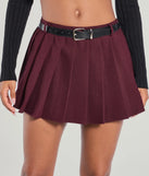 The Downtown Girl Belted Pleated Mini Skirt is a trendy women's bottom in plum, designed with modern details and alluring textures to complete chic outfits for 2025.
