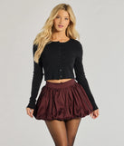 The Luxe Charm Taffeta Bubble Mini Skirt is a trendy women's bottom in burgundy, designed with modern details and alluring textures to complete chic outfits for 2025.