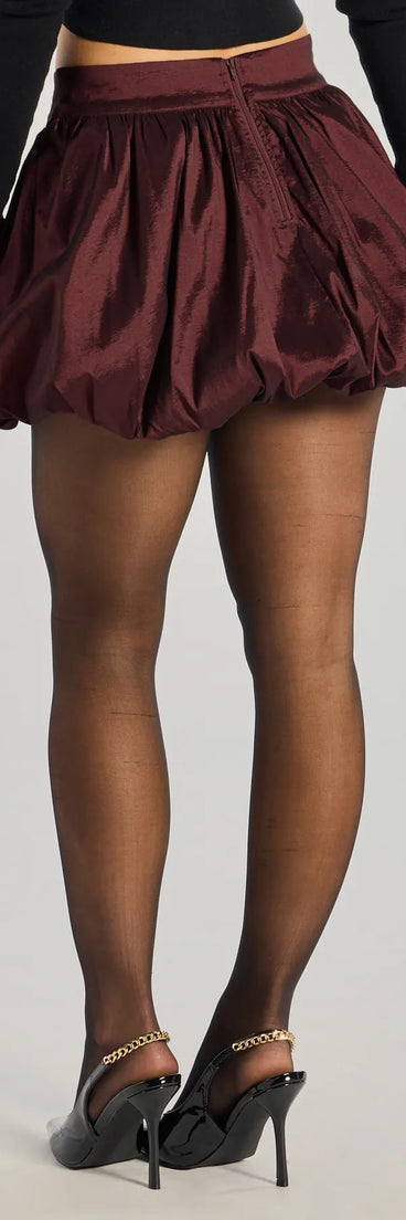 The Luxe Charm Taffeta Bubble Mini Skirt is a trendy women's bottom in burgundy, designed with modern details and alluring textures to complete chic outfits for 2025.