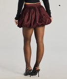 The Luxe Charm Taffeta Bubble Mini Skirt is a trendy women's bottom in burgundy, designed with modern details and alluring textures to complete chic outfits for 2025.