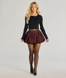 The Luxe Charm Taffeta Bubble Mini Skirt is a trendy women's bottom in burgundy, designed with modern details and alluring textures to complete chic outfits for 2025.