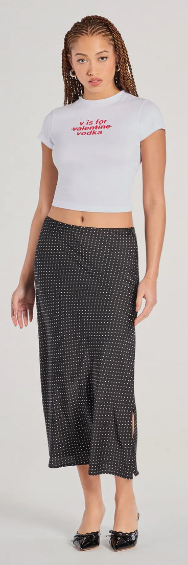 The There She Goes High-Rise Slit Polka Dot Satin Midi Skirt is a trendy women's bottom in black, designed with modern details and alluring textures to complete chic outfits for 2025.