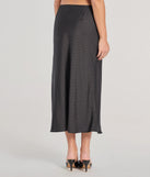 Create bold, fashion-forward looks for spring or summer with the There She Goes High-Rise Slit Polka Dot Satin Midi Skirt in black, a must-have piece from Windsor’s collection of stylish bottoms for women.