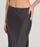 Create bold, fashion-forward looks for spring or summer with the There She Goes High-Rise Slit Polka Dot Satin Midi Skirt in black, a must-have piece from Windsor’s collection of stylish bottoms for women.