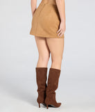 The Keeping It Simple Faux Suede Slit Mini Skirt in tan features a short, flattering cut designed to elevate your look with just the right amount of edge.