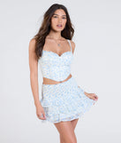 Create bold, fashion-forward looks for spring or summer with the Special Moment Floral Glitter Dot Mini Skirt in ivory, a must-have piece from Windsor’s collection of stylish bottoms for women.