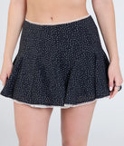 Create bold, fashion-forward looks for spring or summer with the Delightful Duo Polka Dot Ruffle Skirt in black, a must-have piece from Windsor’s collection of stylish bottoms for women.