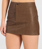 The Sleek Style Sense Bodycon Mini Skirt in brown brings edge and energy to your vibe, ready to elevate any festival look or concert outfit.