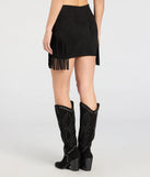 The Fringe Attitude Faux Suede Mini Skirt in black features a short, flattering cut designed to elevate your look with just the right amount of edge.