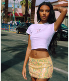 Choosing the yellow skirt says you’re ready to show off in the Night Moves Sequin Mini Skirt, a warm-weather staple that elevates your outfit and seasonal style.