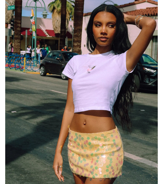 Choosing the yellow skirt says you’re ready to show off in the Night Moves Sequin Mini Skirt, a warm-weather staple that elevates your outfit and seasonal style.