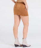 The Total Charmer Low-Rise V-Waist Mini Skirt in camel brown features a short, flattering cut designed to elevate your look with just the right amount of edge.