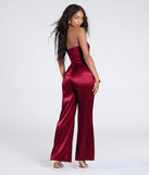 Create bold, fashion-forward looks for spring or summer with the Looking Luxe Cutout Satin Wide-Leg Jumpsuit in red, a must-have piece from Windsor’s collection of stylish bottoms for women.
