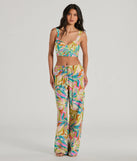 The Getaway Retreat High Rise Tropical Pants in multi-color is a pair of women's pants with an on-trend leg style and elevated fabric that adds texture, perfect for crafting effortless winter outfits.