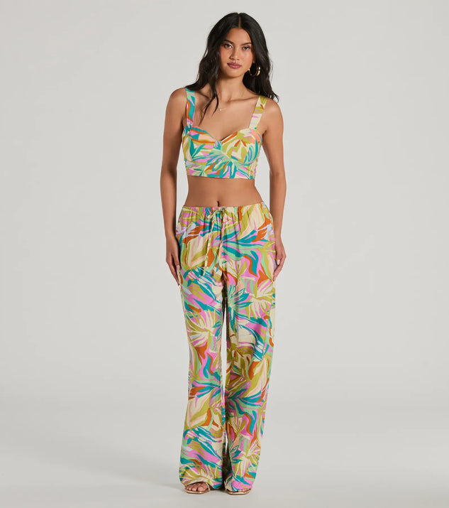The Getaway Retreat High Rise Tropical Pants in multi-color is a pair of women's pants with an on-trend leg style and elevated fabric that adds texture, perfect for crafting effortless winter outfits.